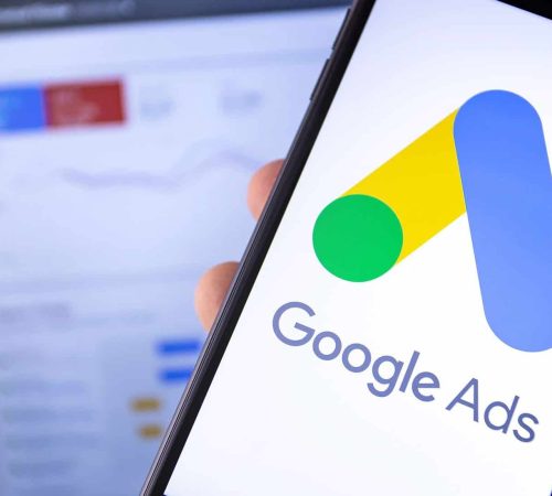 Google Ads management on mobile device for ad campaign success.