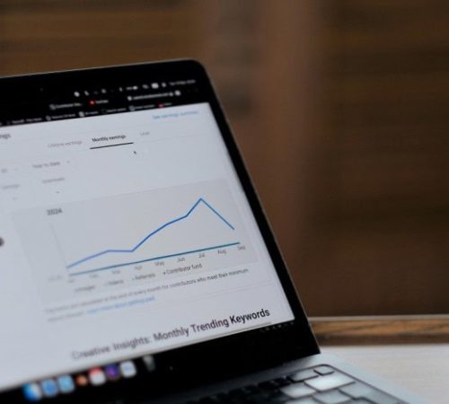 Digital marketing analytics on a laptop screen for SEO and AI strategies.